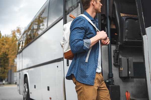 Man boards bus parked at Designer Outlet Roermond